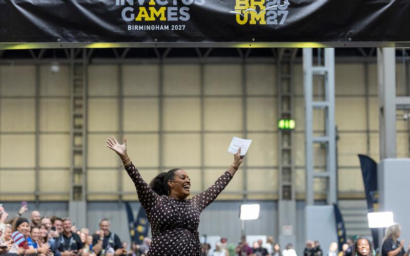 Alison hammonD in the NEC arms in the air.