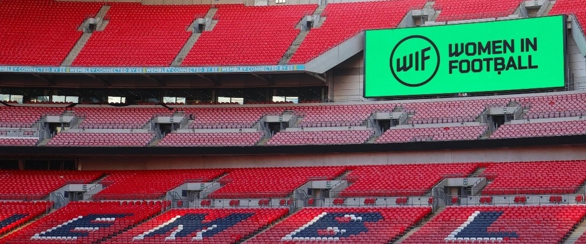 Women in Football branding on screen inside Wembley Stadium