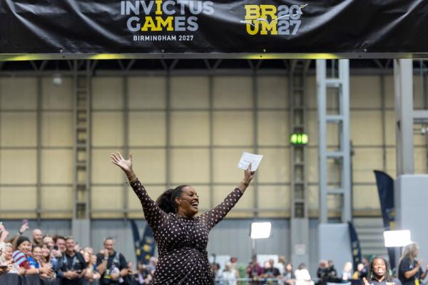 Alison hammon in the NEC arms in the air.